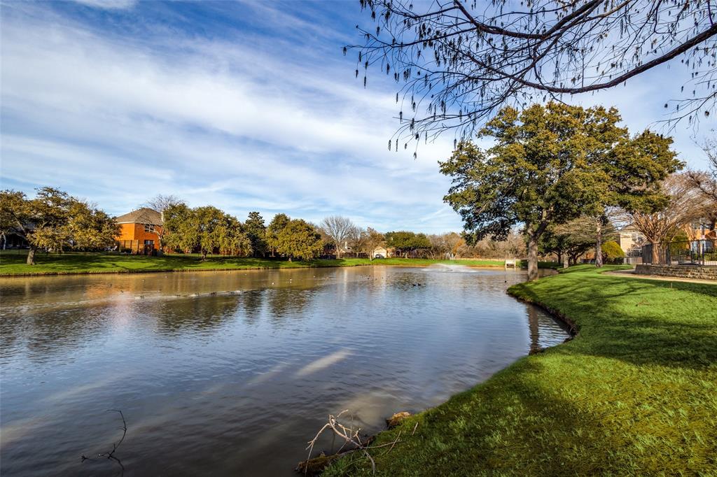 1524 Rustic Timbers Lane Flower Mound, TX 75028 - Photo 24 of 28 a view of a lake with houses in the back