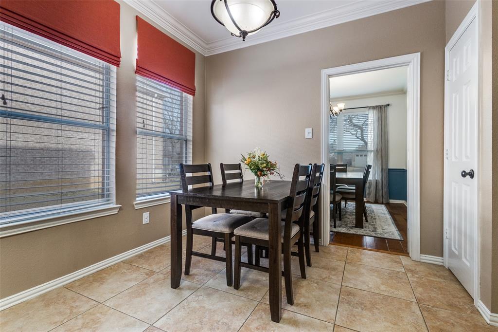 1524 Rustic Timbers Lane Flower Mound, TX 75028 - Photo 5 of 28 a view of a dining room with furniture and a window