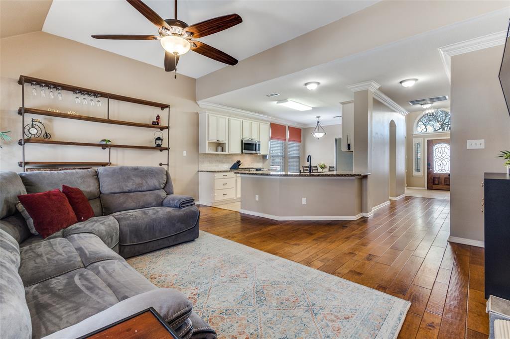 1524 Rustic Timbers Lane Flower Mound, TX 75028 - Photo 8 of 28 a living room with stainless steel appliances furniture and a kitchen view