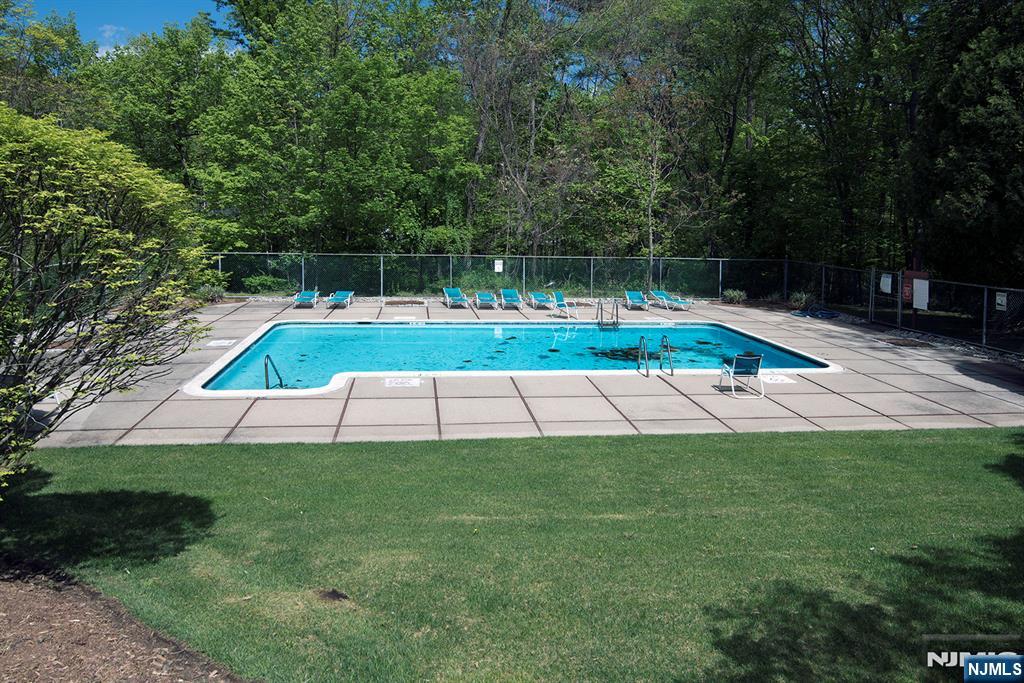 1103 Hilltop Road Mahwah, NJ 07430 - Photo 15 of 17 a view of backyard with swimming pool and seating space