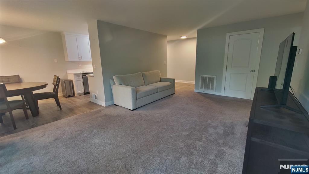 1103 Hilltop Road Mahwah, NJ 07430 - Photo 8 of 17 a living room with furniture and a couch