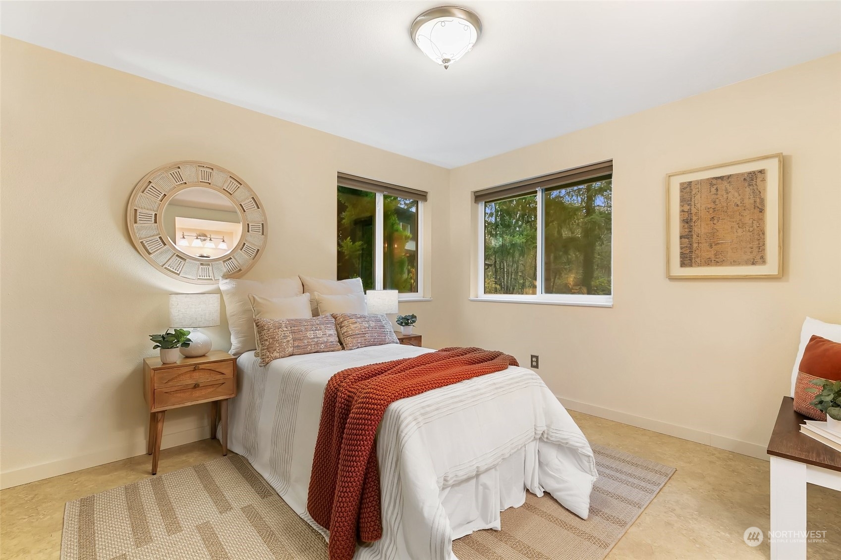 22214 Sweeney Road Southeast Maple Valley, WA 98038 - Photo 15 of 40 a bedroom with a bed and a lamp on dresser next to a window