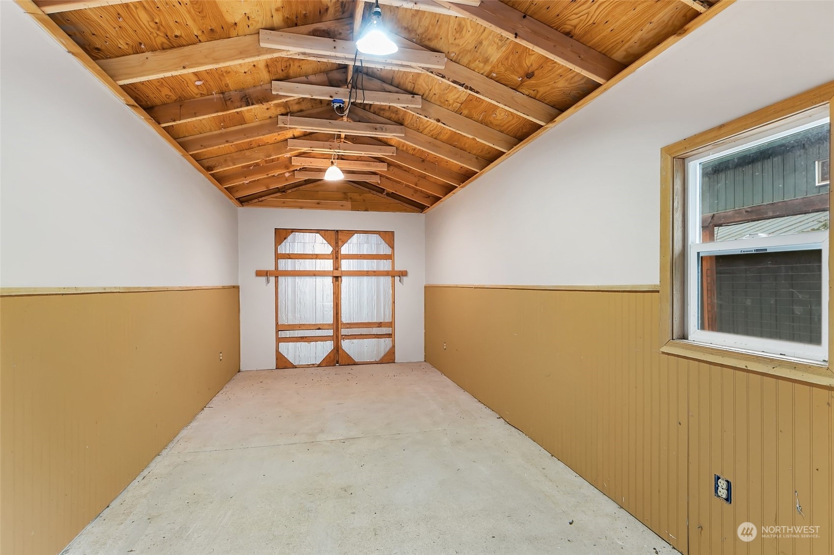 22214 Sweeney Road Southeast Maple Valley, WA 98038 - Photo 30 of 40 a view of an empty room with a window