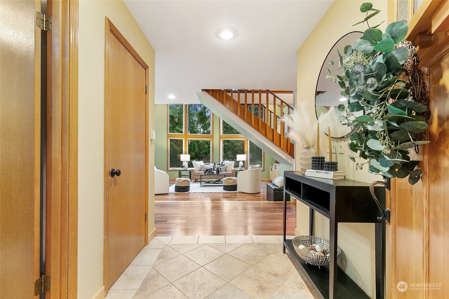 22214 Sweeney Road Southeast Maple Valley, WA 98038 - Photo 3 of 40 a view of entryway and hall with wooden floor