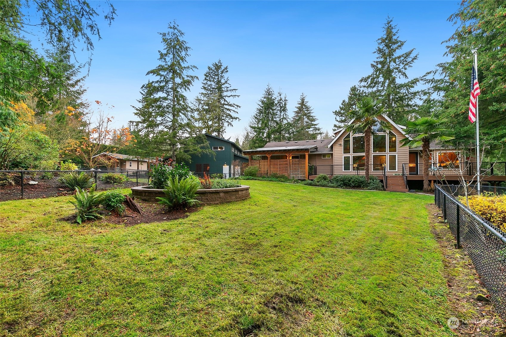 22214 Sweeney Road Southeast Maple Valley, WA 98038 - Photo 33 of 40 a view of a house with a yard patio and a slide