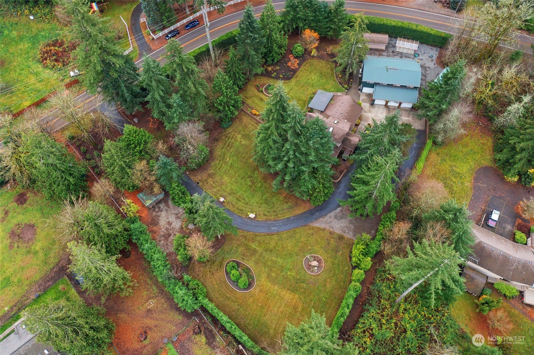 22214 Sweeney Road Southeast Maple Valley, WA 98038 - Photo 36 of 40 an aerial view of a house with a yard