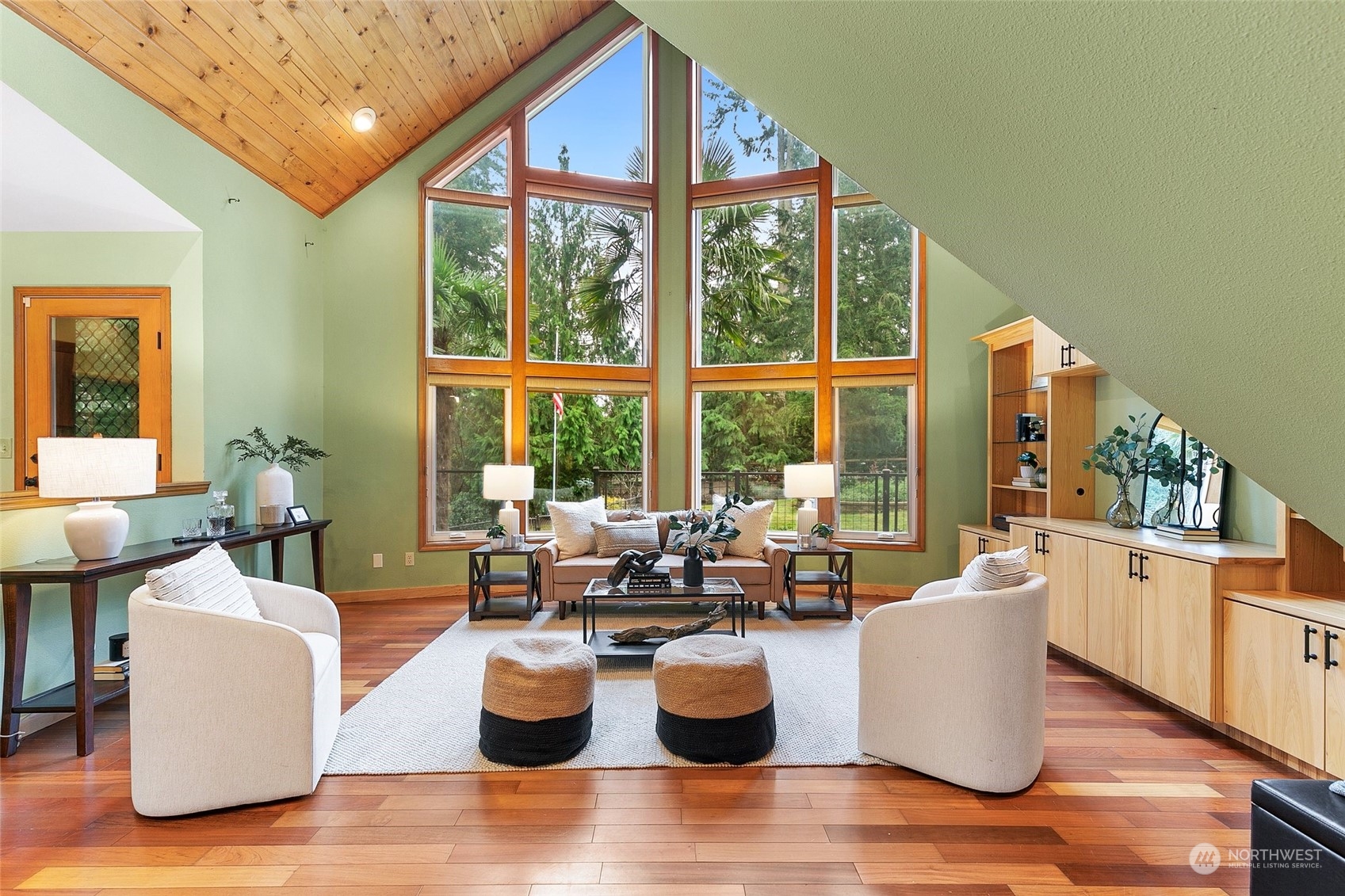 22214 Sweeney Road Southeast Maple Valley, WA 98038 - Photo 5 of 40 a living room with couches and a large window with outer view