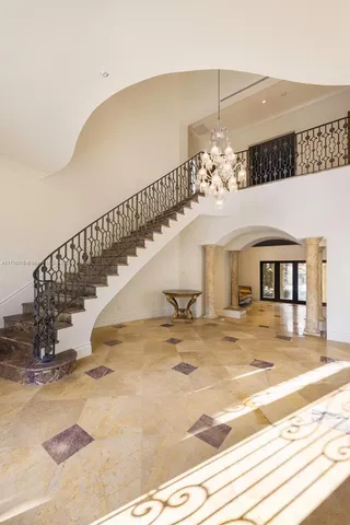 a kitchen with stainless steel appliances granite countertop a stove and cabinets