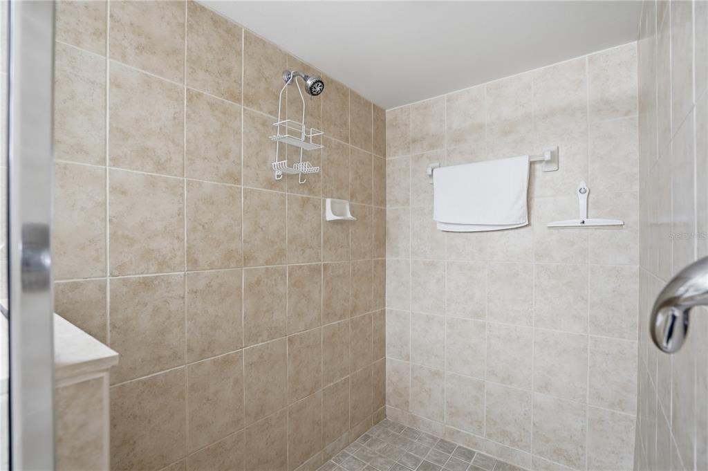 16326 Gulf Boulevard, Unit 307 Redington Beach, FL 33708 - Photo 21 of 43 a bathroom with a shower