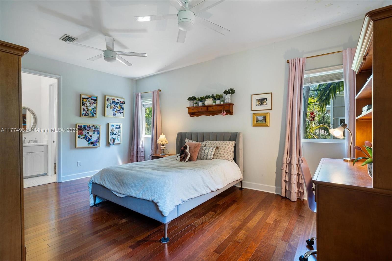 2210 Overbrook Street Miami, FL 33133 - Photo 16 of 26 a bedroom with a bed flat screen tv and a window