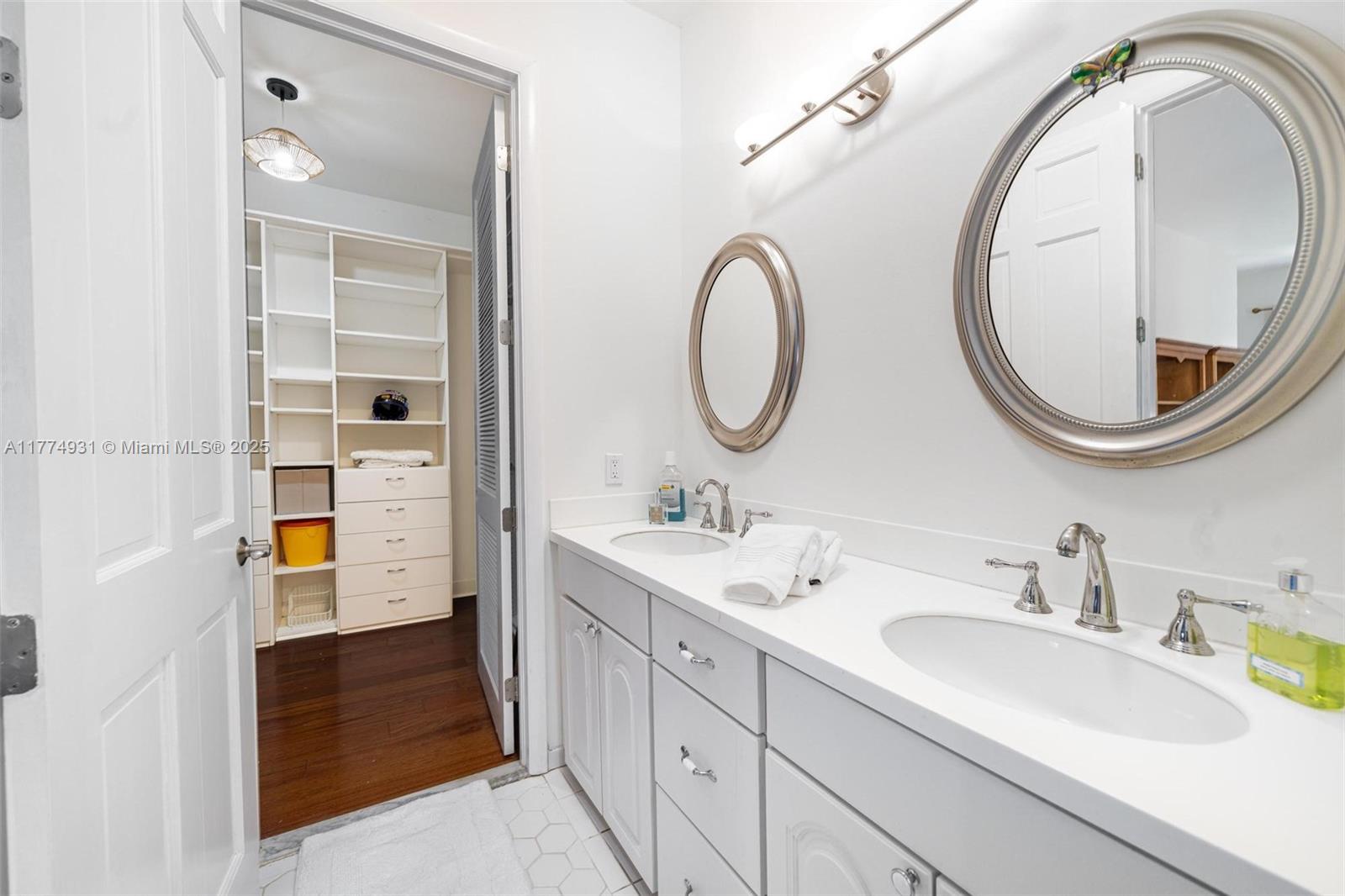 2210 Overbrook Street Miami, FL 33133 - Photo 17 of 26 a bathroom with a granite countertop sink and a mirror