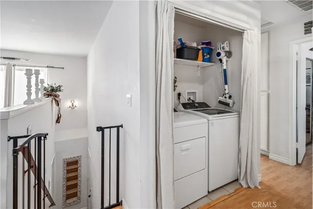 a view of a hallway with closet and toys