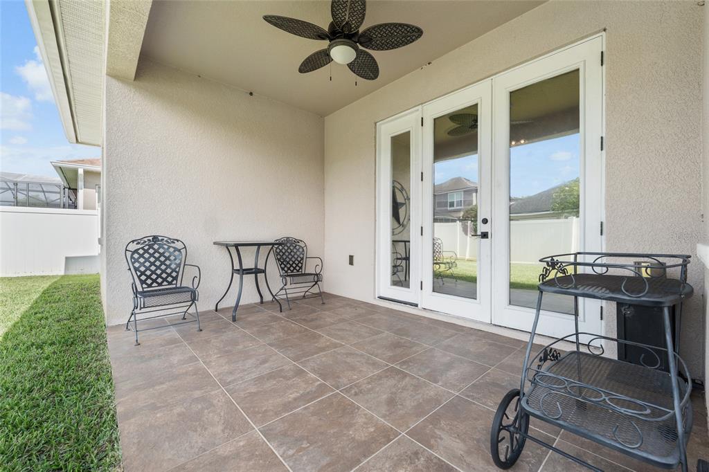 4436 Azure Isle Way Kissimmee, FL 34744 - Photo 26 of 35 a view of a livingroom with furniture and a potted plant