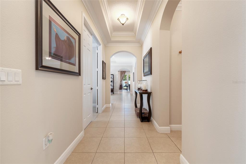 4436 Azure Isle Way Kissimmee, FL 34744 - Photo 3 of 35 a view of a hallway with a furniture