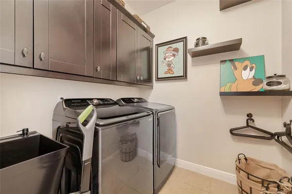a view of storage and utility room with racks on the wall