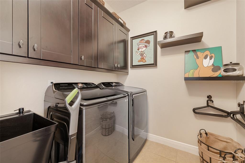 4436 Azure Isle Way Kissimmee, FL 34744 - Photo 7 of 35 a view of storage and utility room with racks on the wall