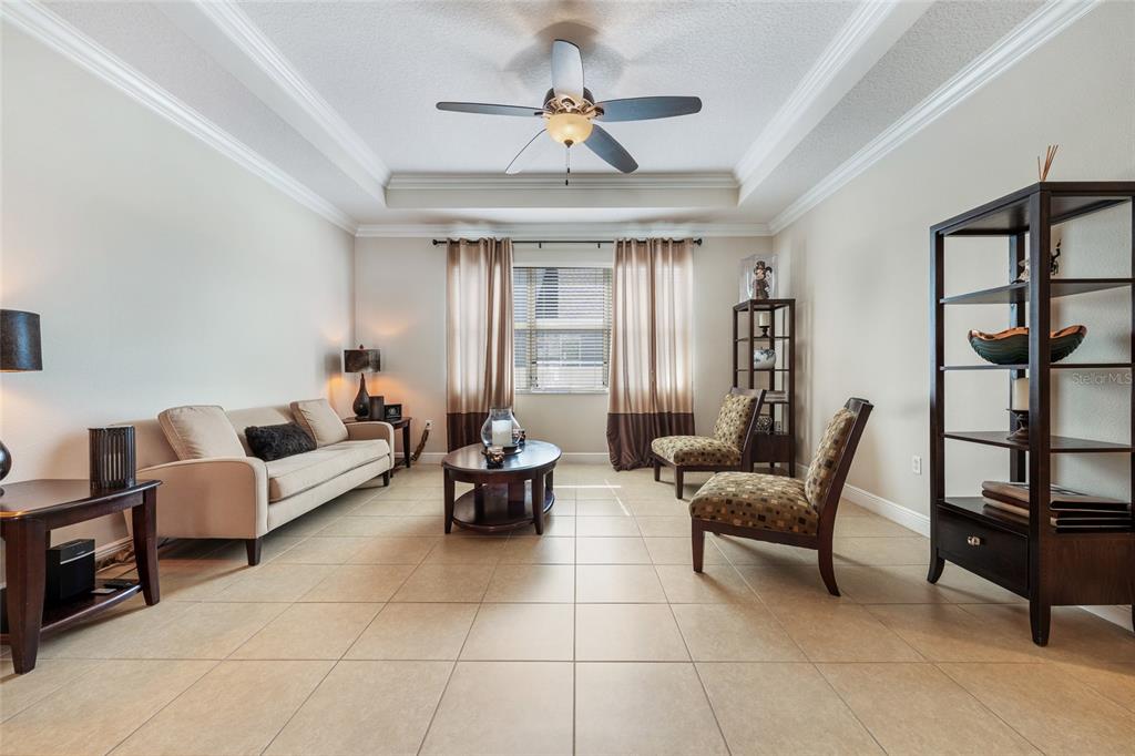 4436 Azure Isle Way Kissimmee, FL 34744 - Photo 10 of 35 a living room with furniture and a window