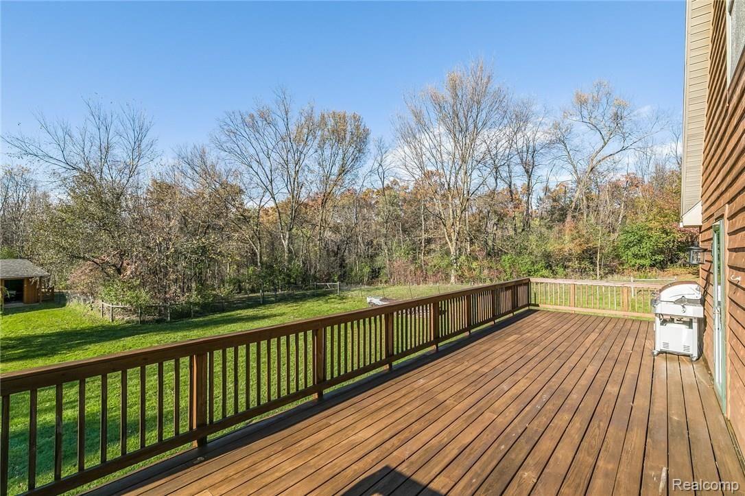 277 North Baldwin Road Oxford, MI 48371 - Photo 34 of 45 WRAP-AROUND DECK