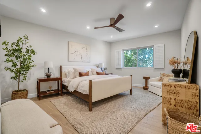 a spacious bathroom with a double vanity sink and a mirror