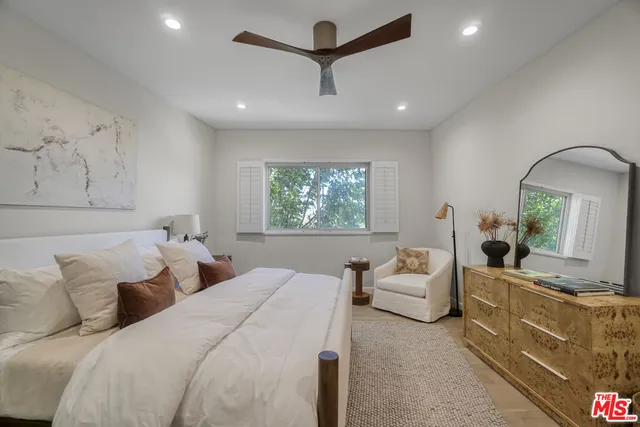 a bathroom with a shower sink and mirror