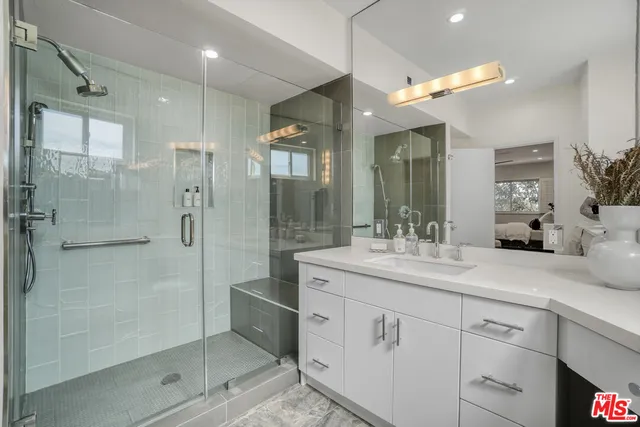 a spacious bedroom with a bed and a table