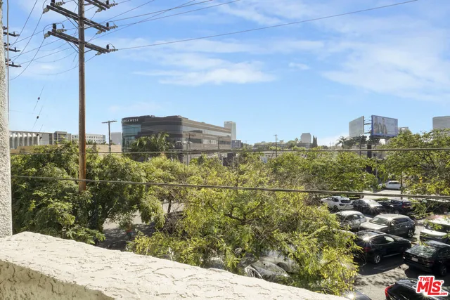 a view of washer and dryer with kitchen in the background