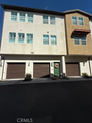 a front view of a house with yard