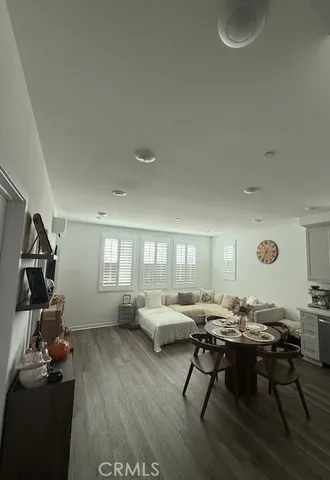 a living room with furniture pool table and a window