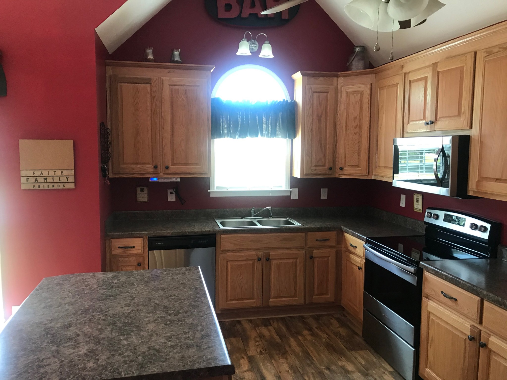 3 Ben Thompson Road Kelso, TN 37348 - Photo 6 of 24 a kitchen with stainless steel appliances granite countertop a stove a sink and a microwave