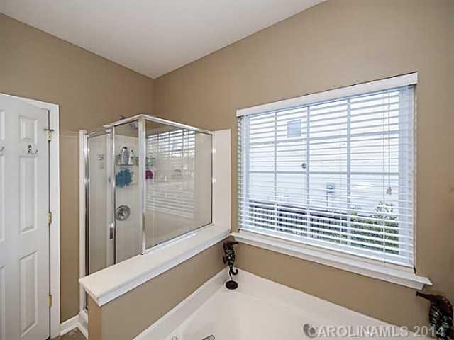 4920 Missi Lane Fort Mill, SC 29708 - Photo 10 of 16 a bathroom with a bathtub and a shower