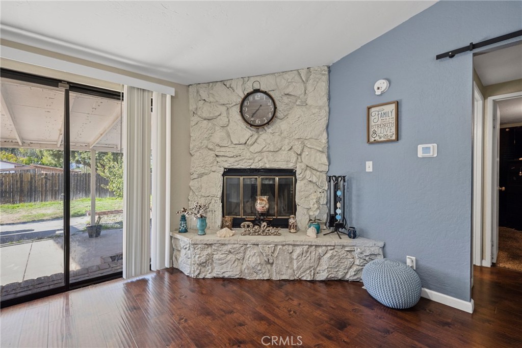34437 Tree Lane Wildomar, CA 92595 - Photo 11 of 42 a living room with furniture and a fireplace