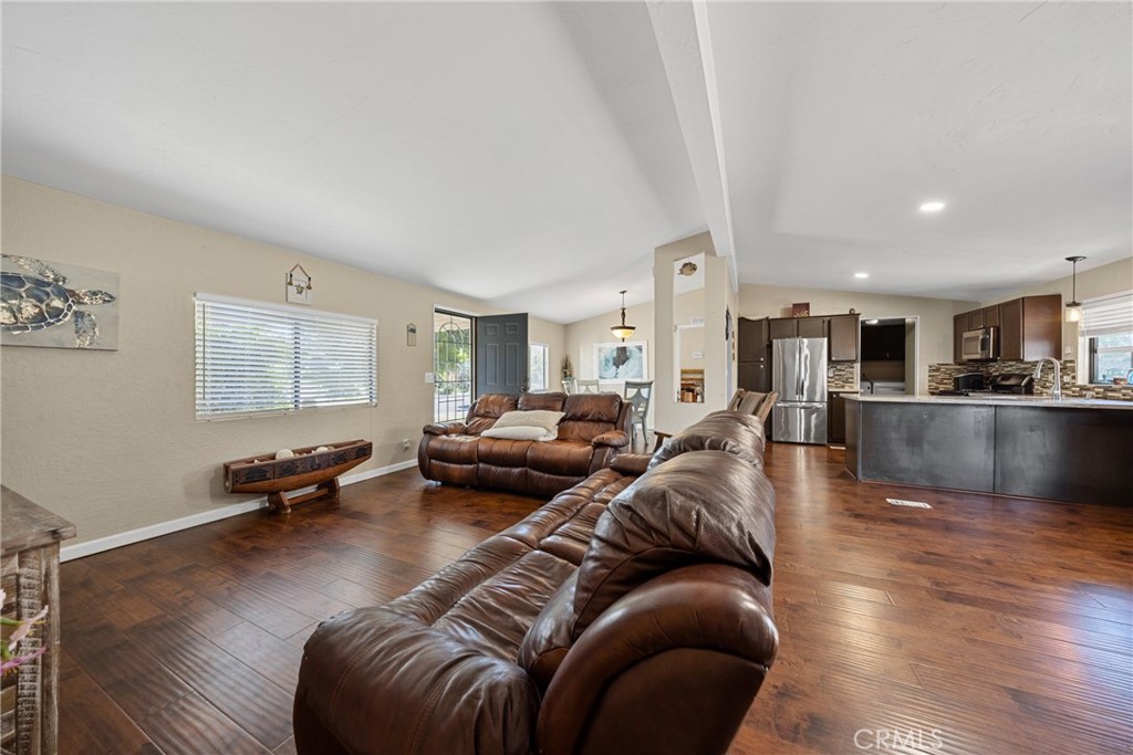34437 Tree Lane Wildomar, CA 92595 - Photo 12 of 42 a living room with furniture and a wooden floor