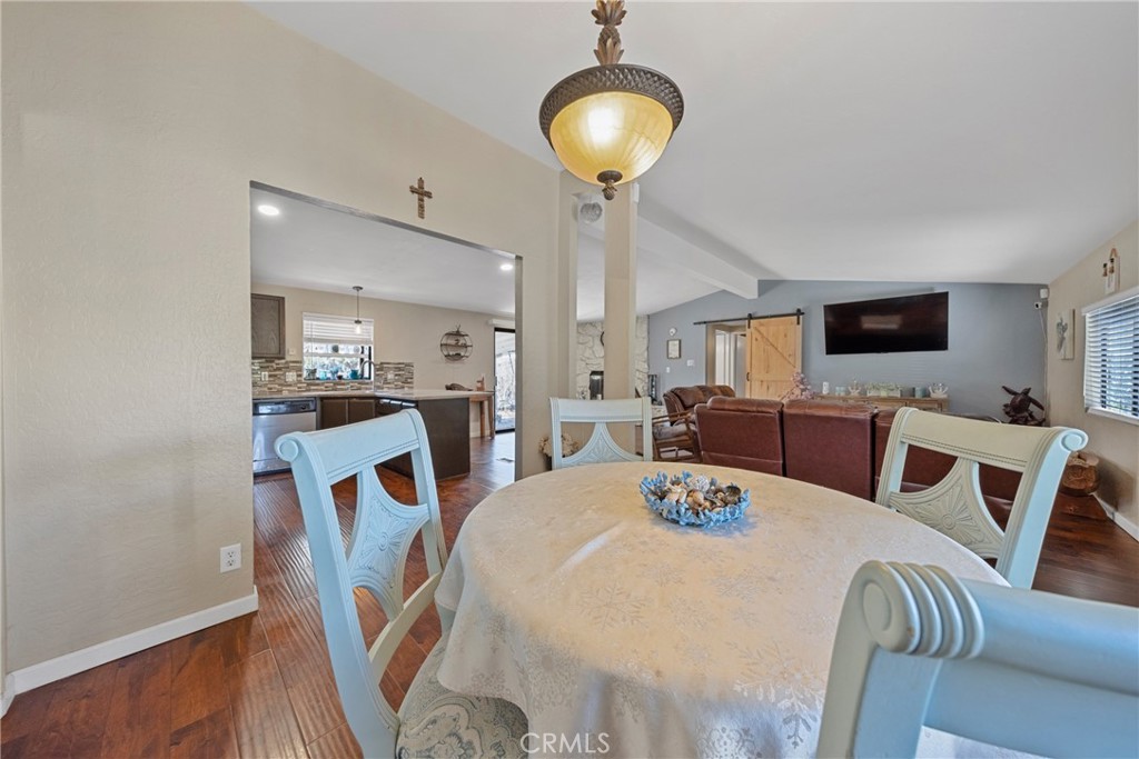 34437 Tree Lane Wildomar, CA 92595 - Photo 13 of 42 a view of a dining room with furniture and wooden floor