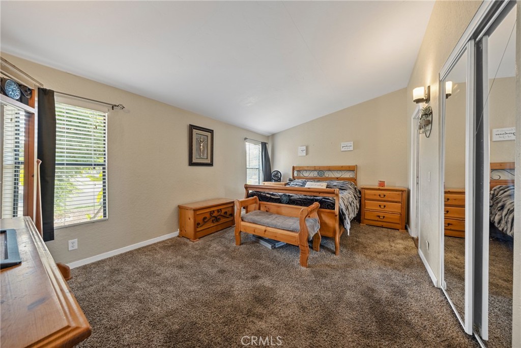 34437 Tree Lane Wildomar, CA 92595 - Photo 18 of 42 a bedroom with furniture and a window