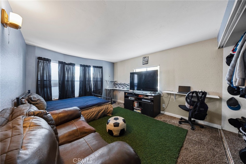 34437 Tree Lane Wildomar, CA 92595 - Photo 20 of 42 a living room with furniture and a flat screen tv