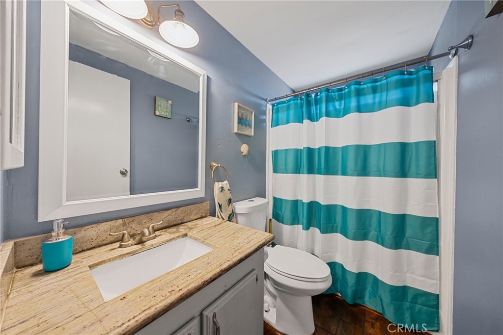 34437 Tree Lane Wildomar, CA 92595 - Photo 22 of 42 a bathroom with a sink and a toilet