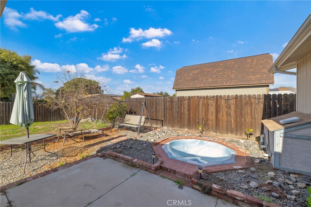 34437 Tree Lane Wildomar, CA 92595 - Photo 24 of 42 a backyard of a house with table and chairs