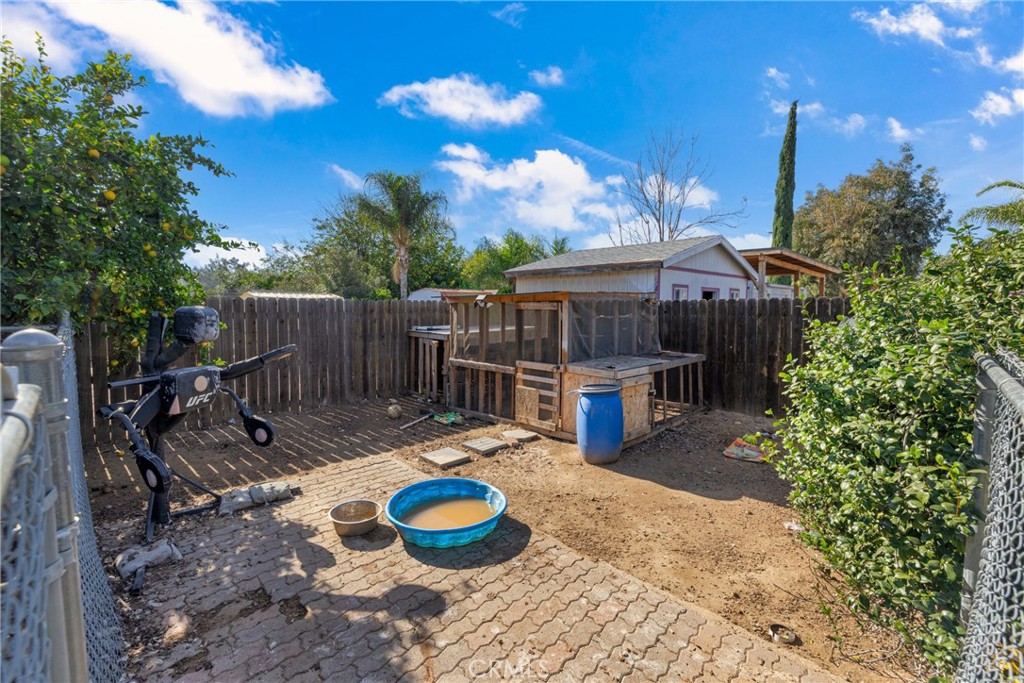 34437 Tree Lane Wildomar, CA 92595 - Photo 28 of 42 a view of a wooden deck and a backyard
