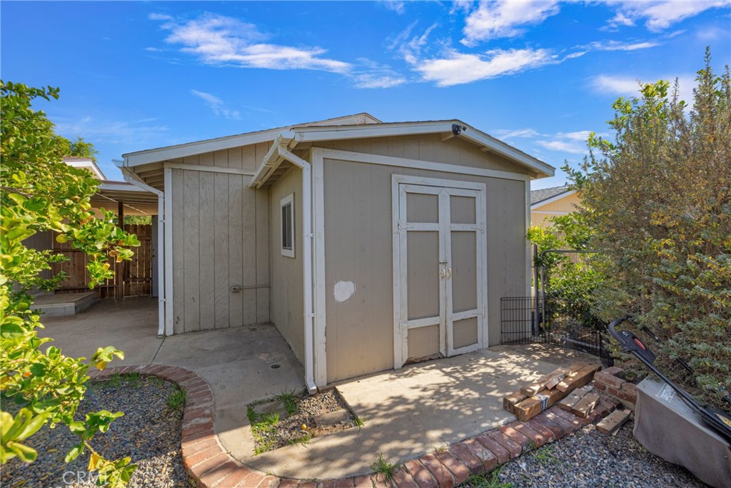 34437 Tree Lane Wildomar, CA 92595 - Photo 29 of 42 a backyard of a house with plants and outdoor seating