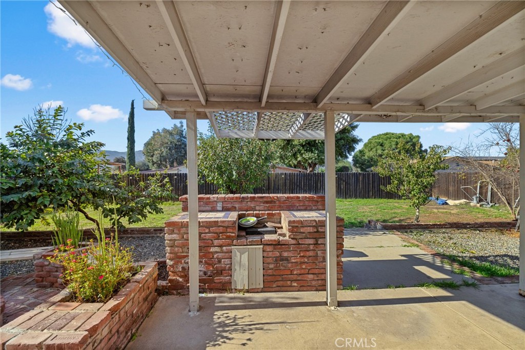34437 Tree Lane Wildomar, CA 92595 - Photo 33 of 42 a view of a porch with furniture and floor to ceiling window