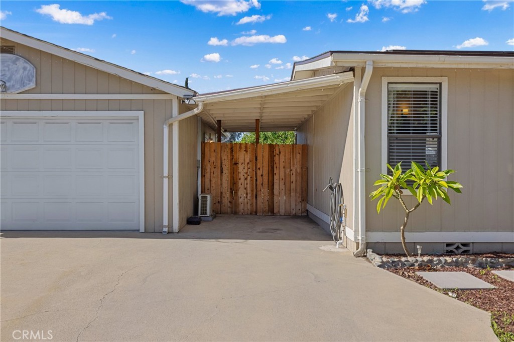 34437 Tree Lane Wildomar, CA 92595 - Photo 35 of 42 a view of a house with a potted plant and floor to ceiling window