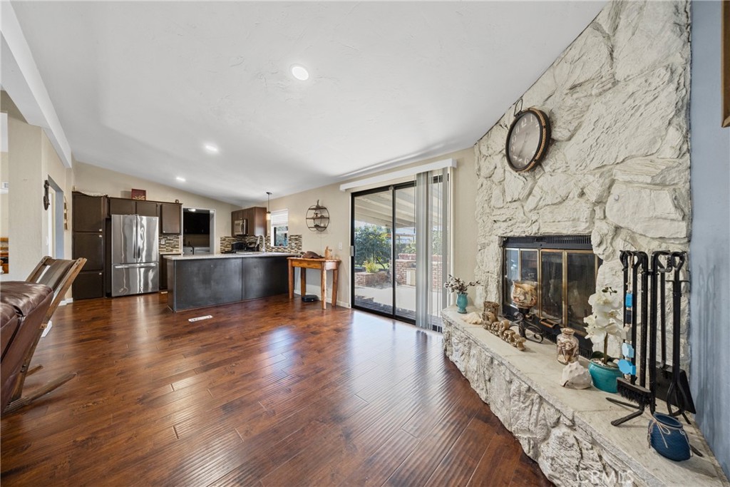 34437 Tree Lane Wildomar, CA 92595 - Photo 4 of 42 a view of a livingroom with furniture hardwood floor and a flat screen tv