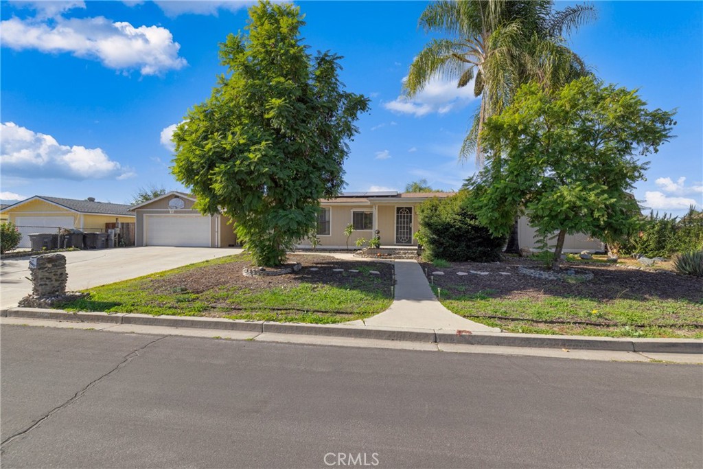 34437 Tree Lane Wildomar, CA 92595 - Photo 41 of 42 a view of fountain in front of a house with large trees