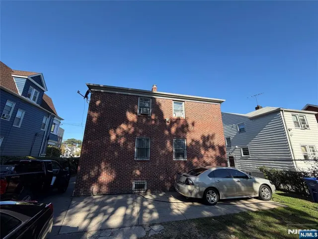 a car parked in front of a house