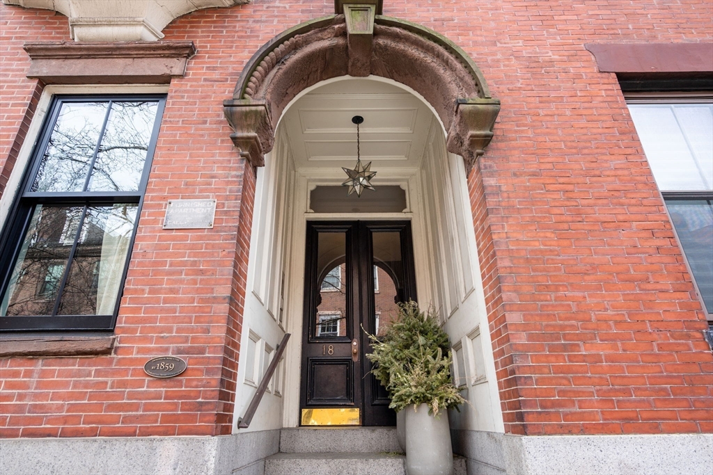18 Harvard Street, Unit 3 Boston, MA 02129 - Photo 13 of 15 a front view of a house with potted plants