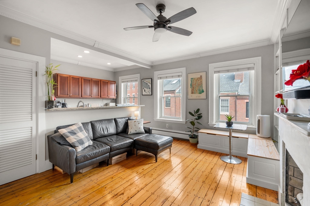 18 Harvard Street, Unit 3 Boston, MA 02129 - Photo 4 of 15 a living room with furniture and a large window