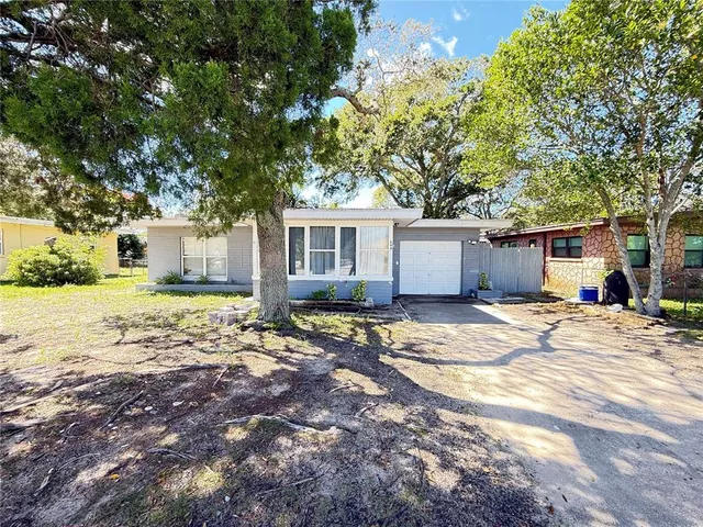a view of a house with snow on the background