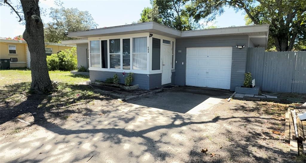 808 Derbyshire Road Daytona Beach, FL 32117 - Photo 7 of 23 a front view of a house with a yard