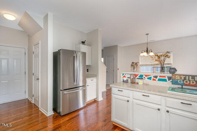 508 Summer Breeze Drive Durham, NC 27704 - Photo 13 of 28 a kitchen with appliances and wooden floor