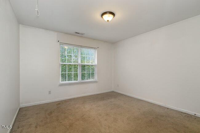 508 Summer Breeze Drive Durham, NC 27704 - Photo 20 of 28 an empty room with a window